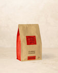 Bag of Classic Plunger coffee with dark chocolate, cinnamon, and brown sugar notes.