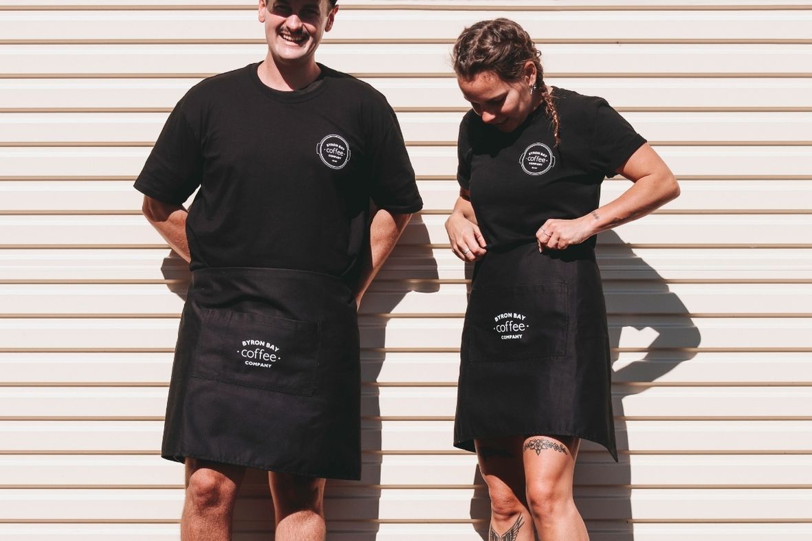 A girl and a boy wearing Byron Bay Coffee Company branded clothes