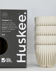 Stack of 4 Natural Huskee Cups with black packaging