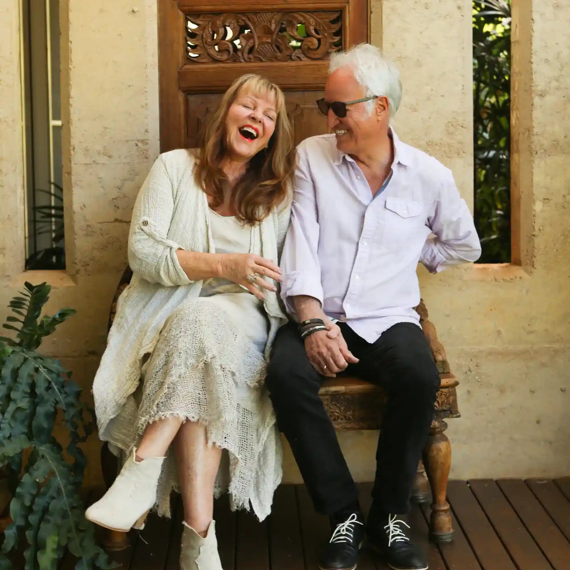 Couple sitting and laughing together
