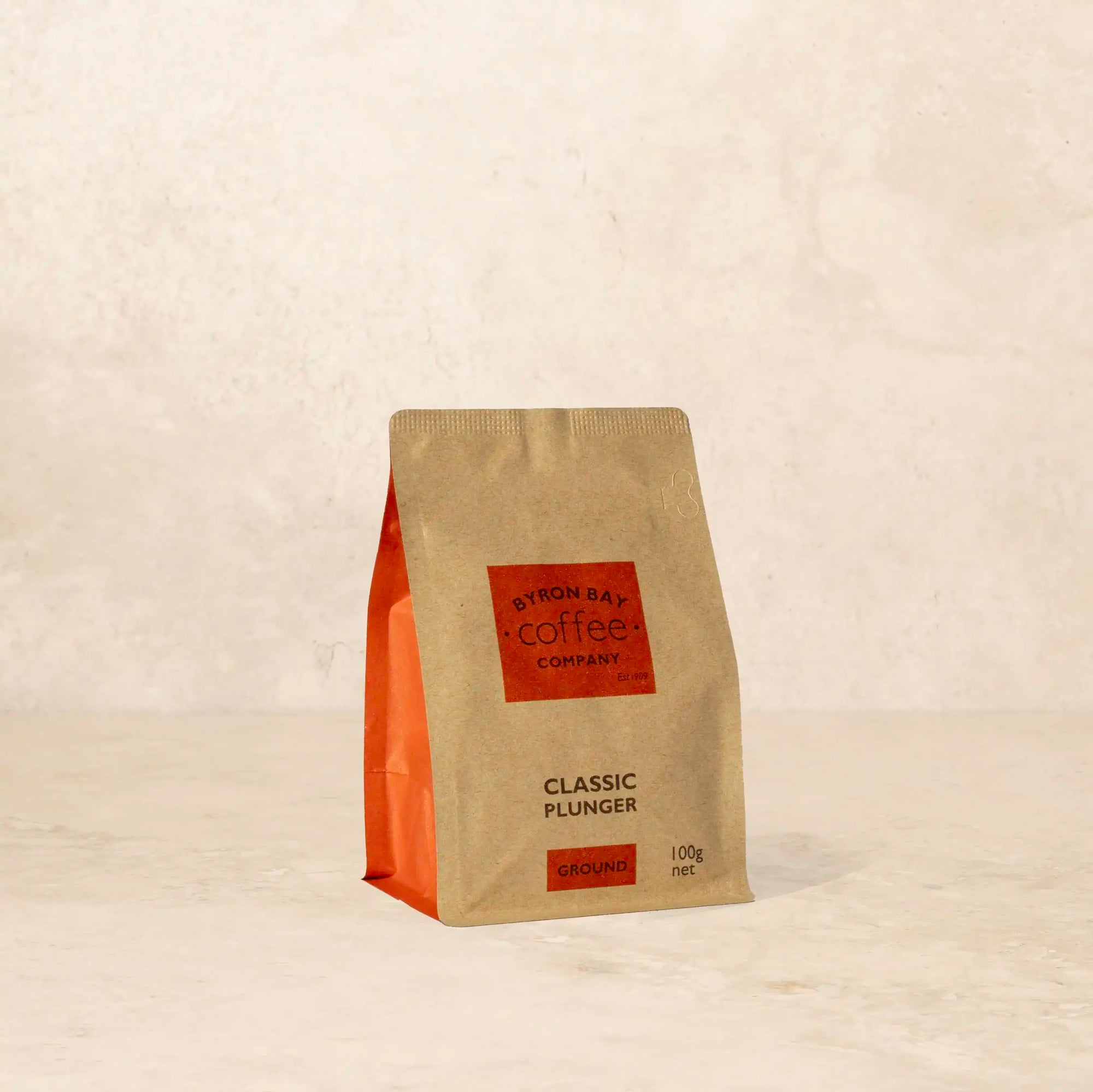 Bag of Classic Plunger coffee with dark chocolate, cinnamon, and brown sugar notes.