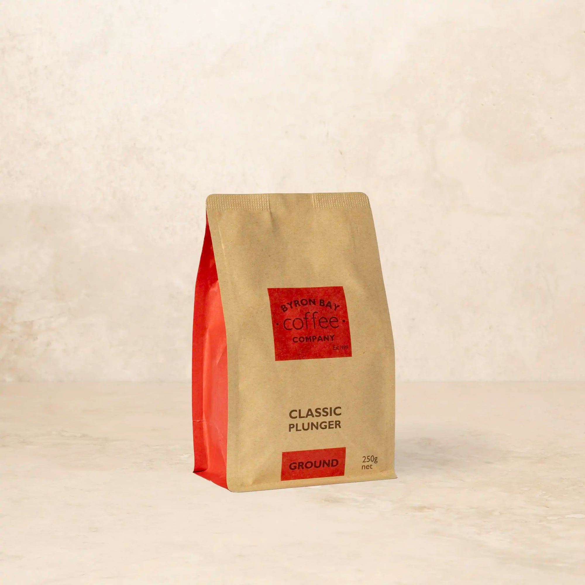 Bag of Classic Plunger coffee with dark chocolate, cinnamon, and brown sugar notes.