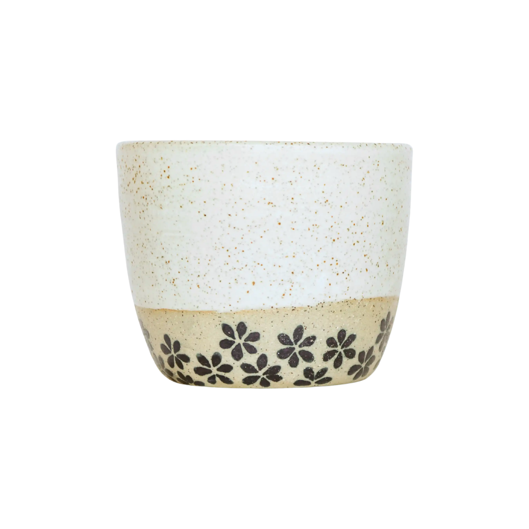 Ceramic coffee cup with floral patterns on a white background