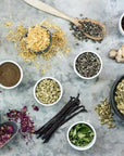 Assorted herbs and spices on a textured background
