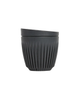 Black ribbed cup on a white background