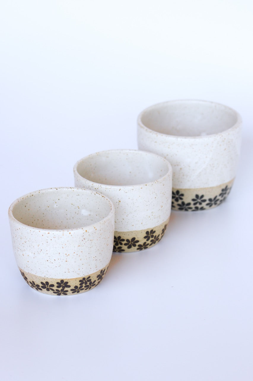 Handmade cup with flower motifs made in Byron Bay