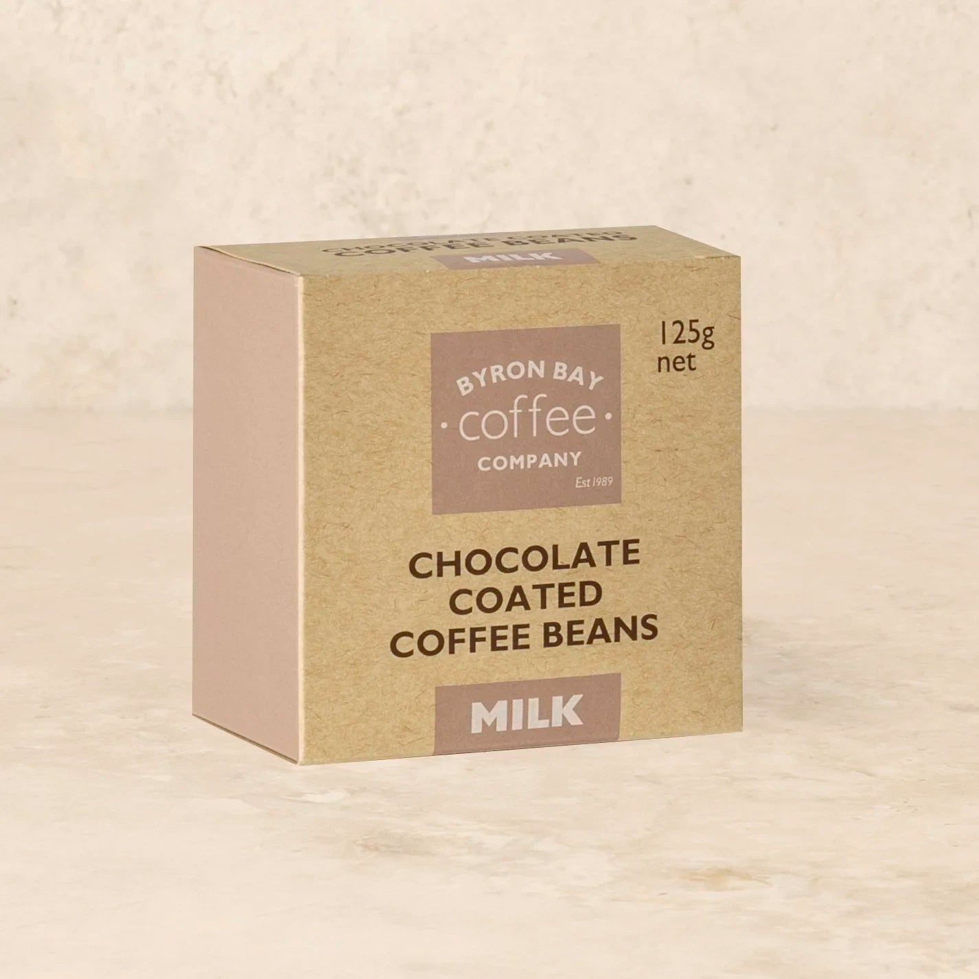 Sweet coffee snack - roasted coffee beans covered in creamy milk chocolate