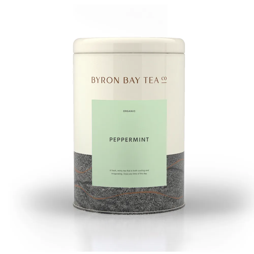 Tin cannister of Byron Bay Tea Company Peppermint tea on white background