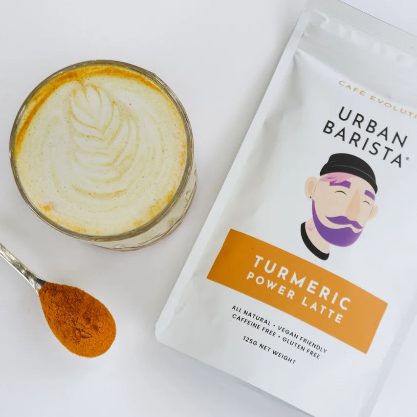 Turmeric latte and packaging on white background