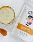 Turmeric latte and packaging on white background